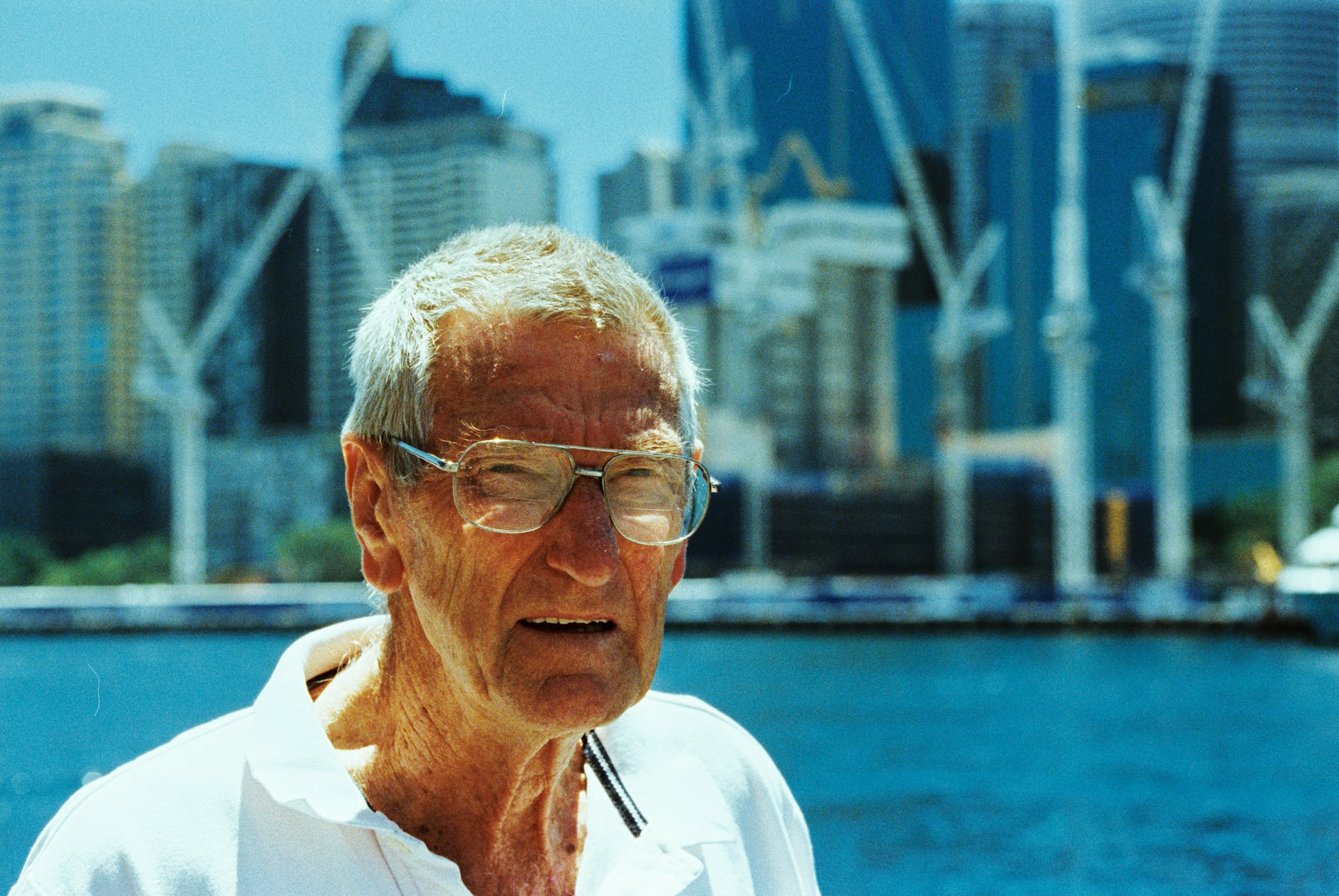 man wearing white polo shirt and eyeglasses